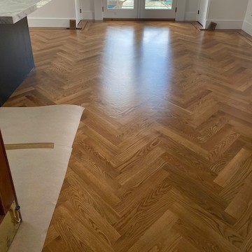 New hardwood floor installation in Quincy, MA single-family home - premium materials and flawless finish by American Builder Hardwood Floor
